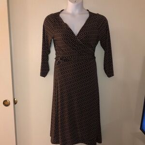 Classic wrap dress with timeless circular pattern.